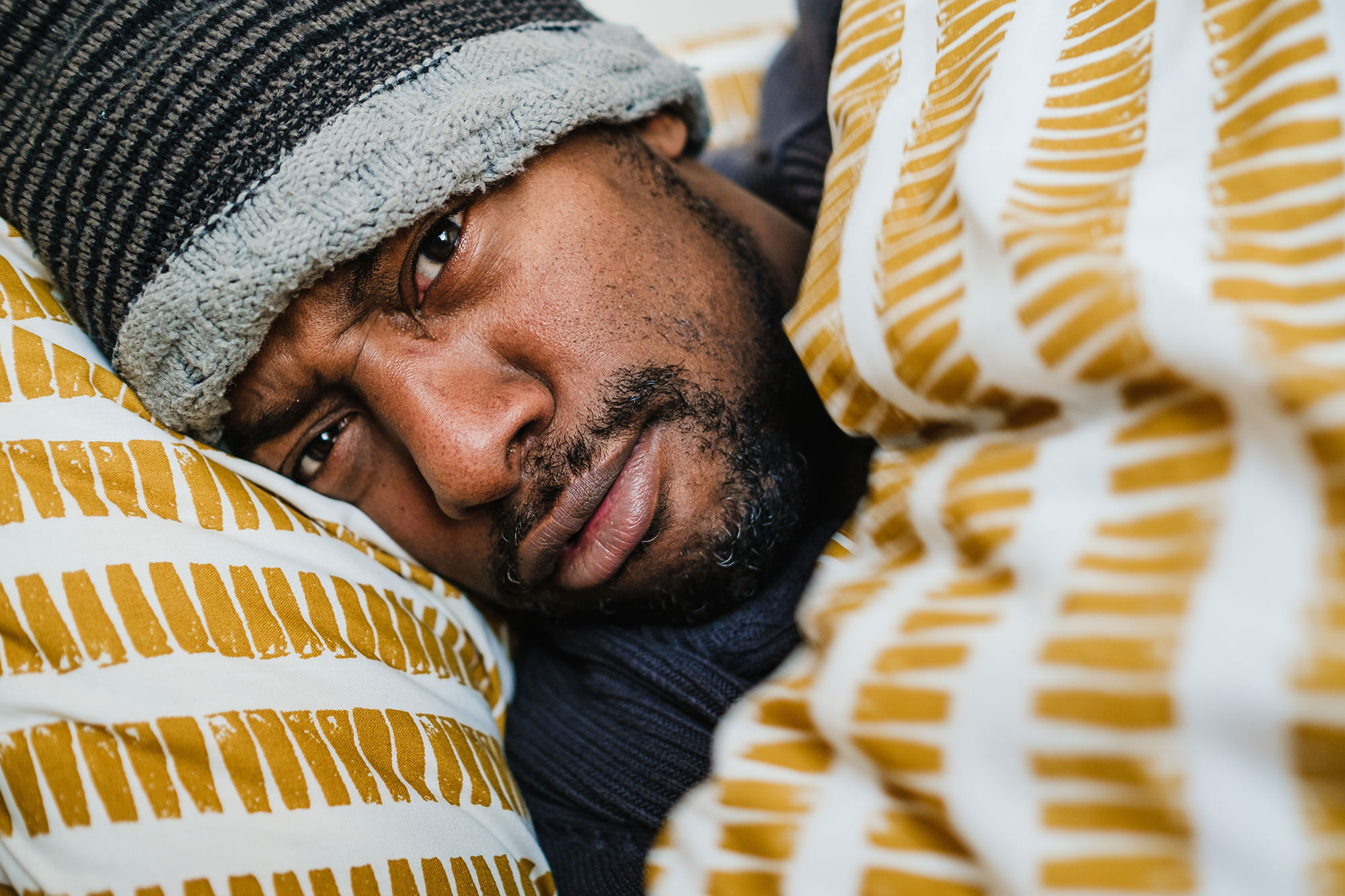 unhappy boyfriend in yellow sheets