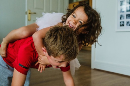 brother and sister playing - documentary family photography