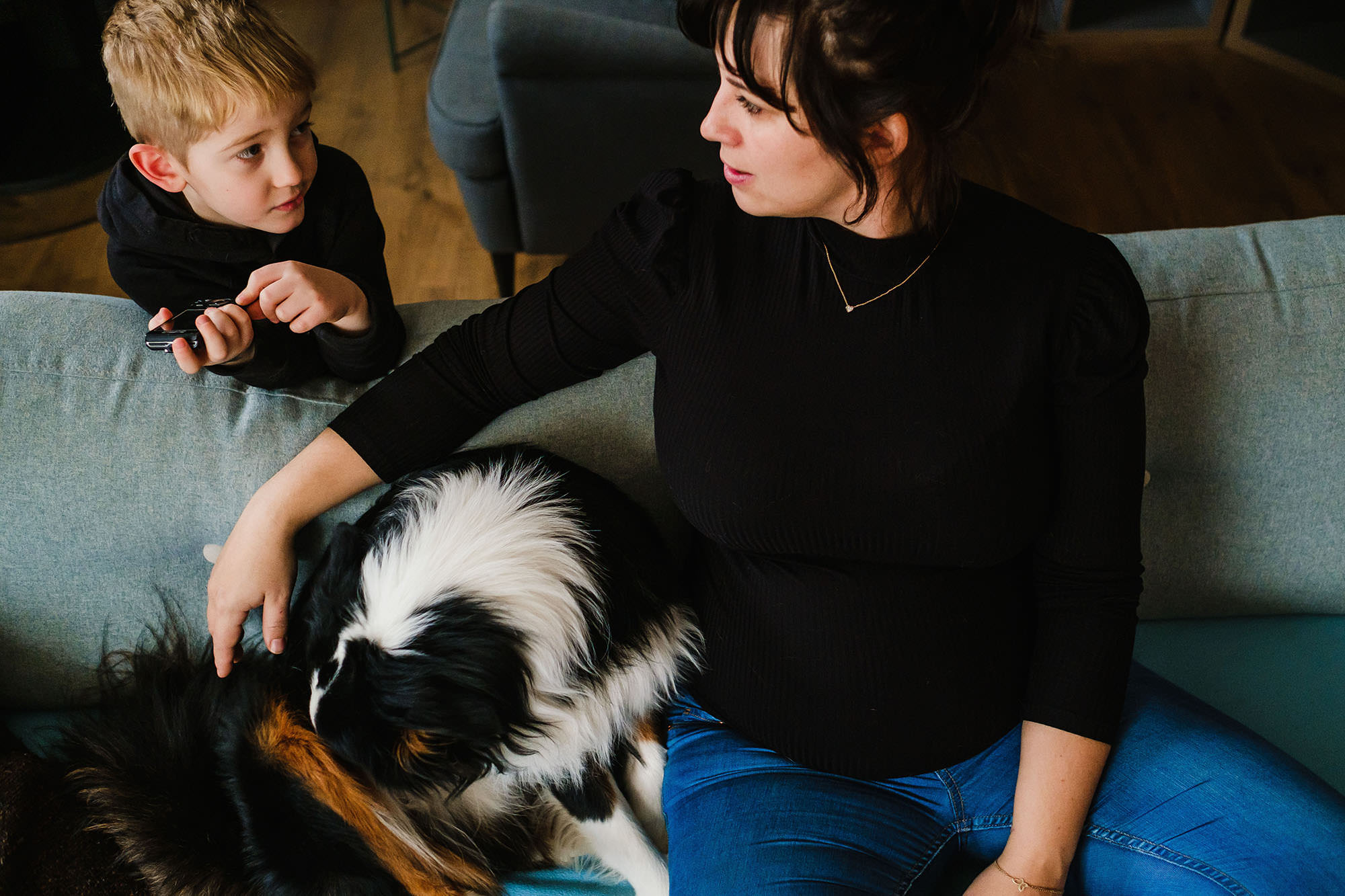 mum and son at home with dog