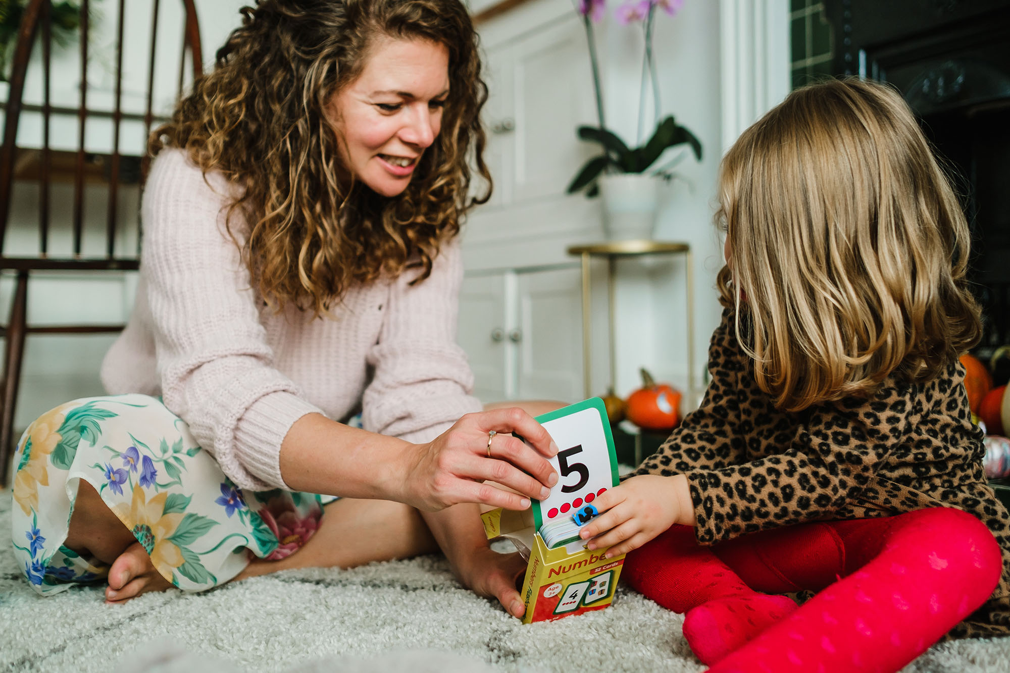 mum and daughter playing cards