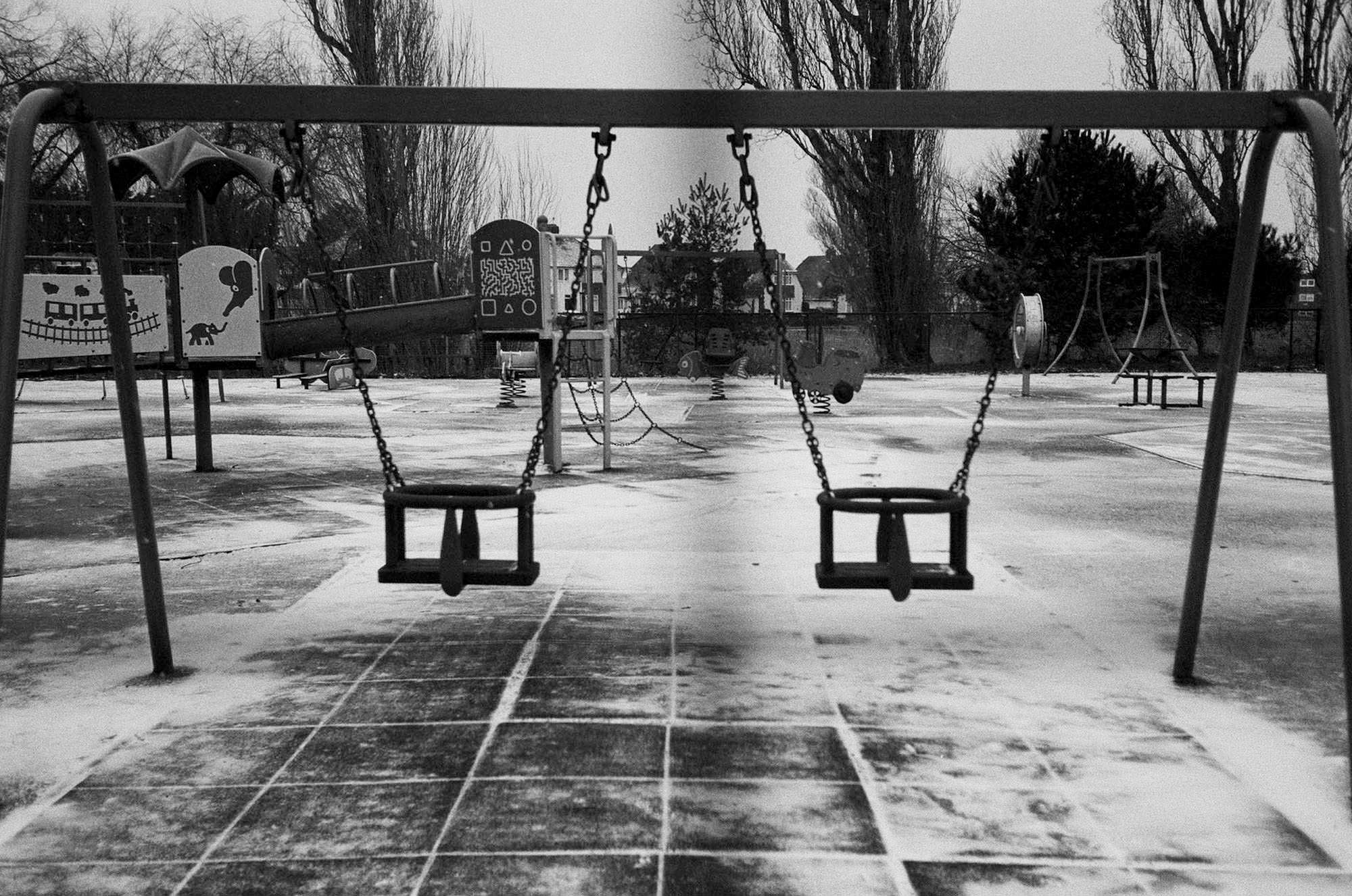 documentary family photographer empty swing set