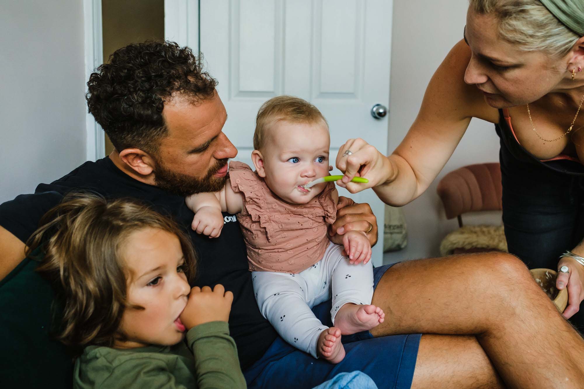 feeding the baby family portrait