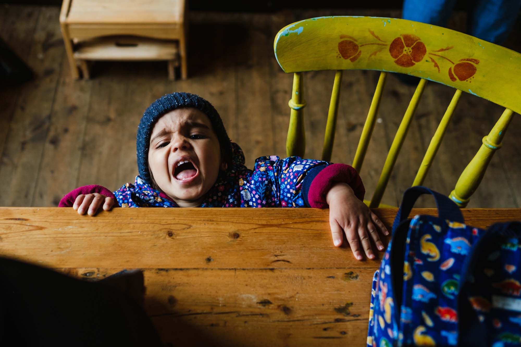 toddler girl having a tantrum at home