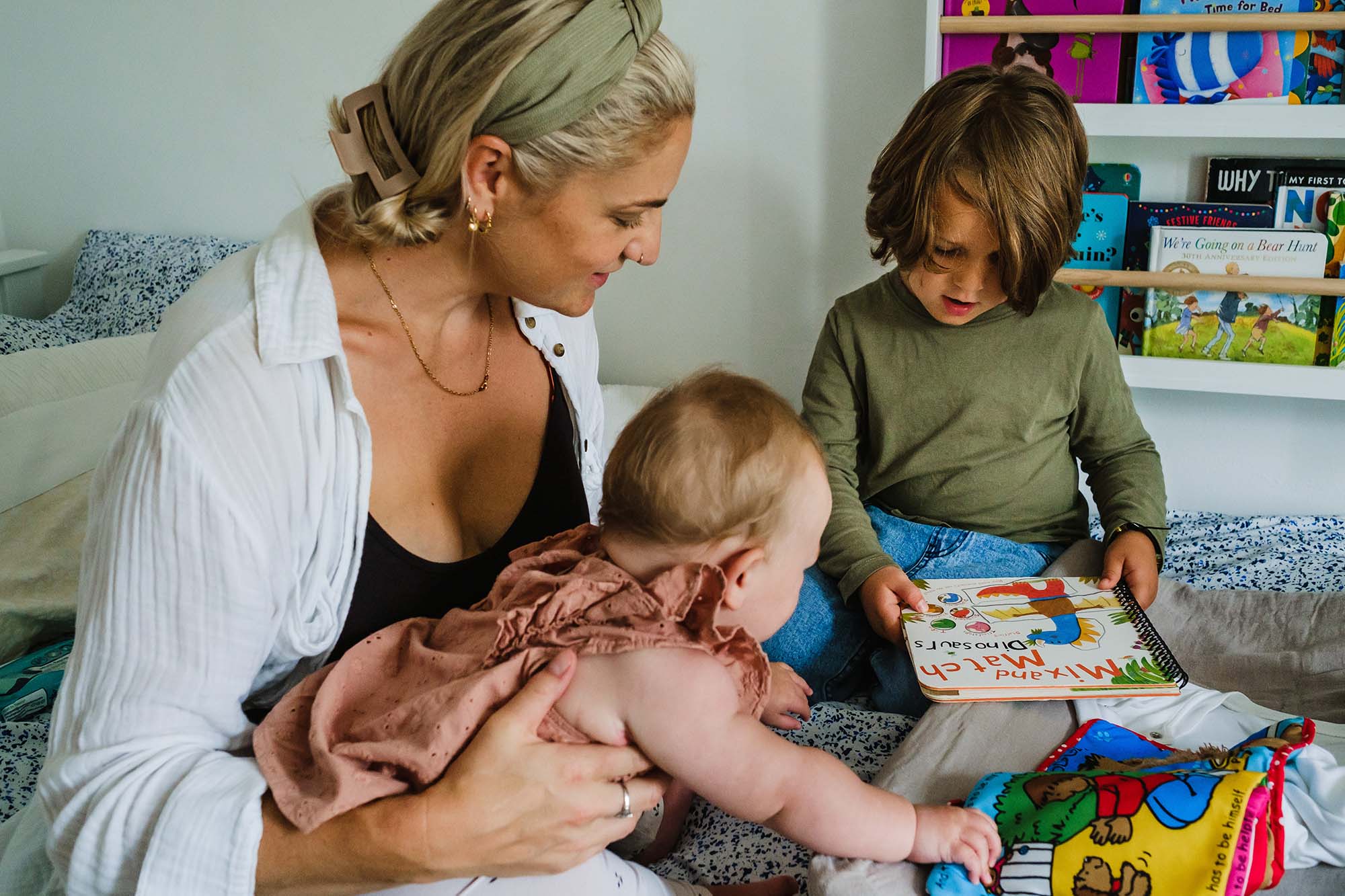 family photos worth taking: Lara mum reading book with son