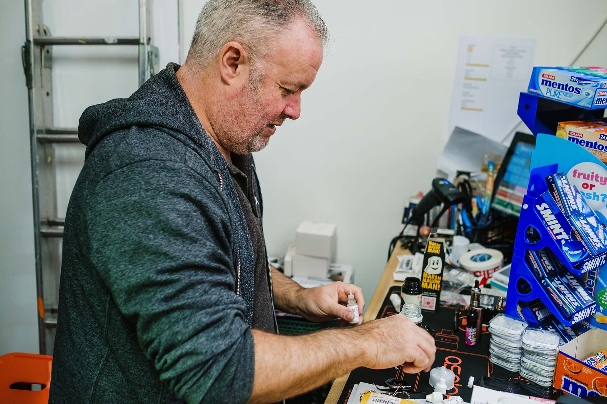 Simon Kwik Vape working in his shop in Worthing