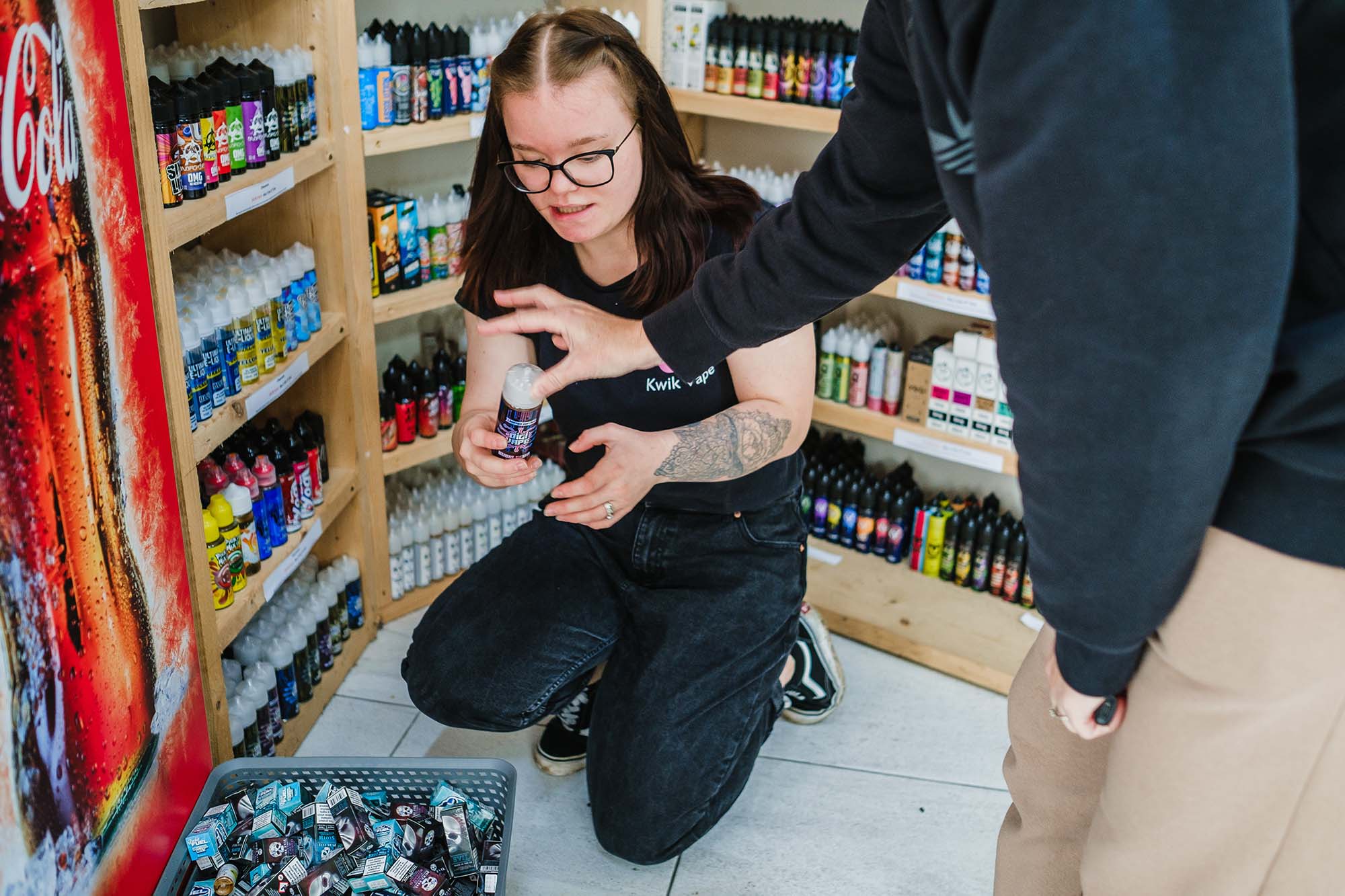 shop staff organising shelves